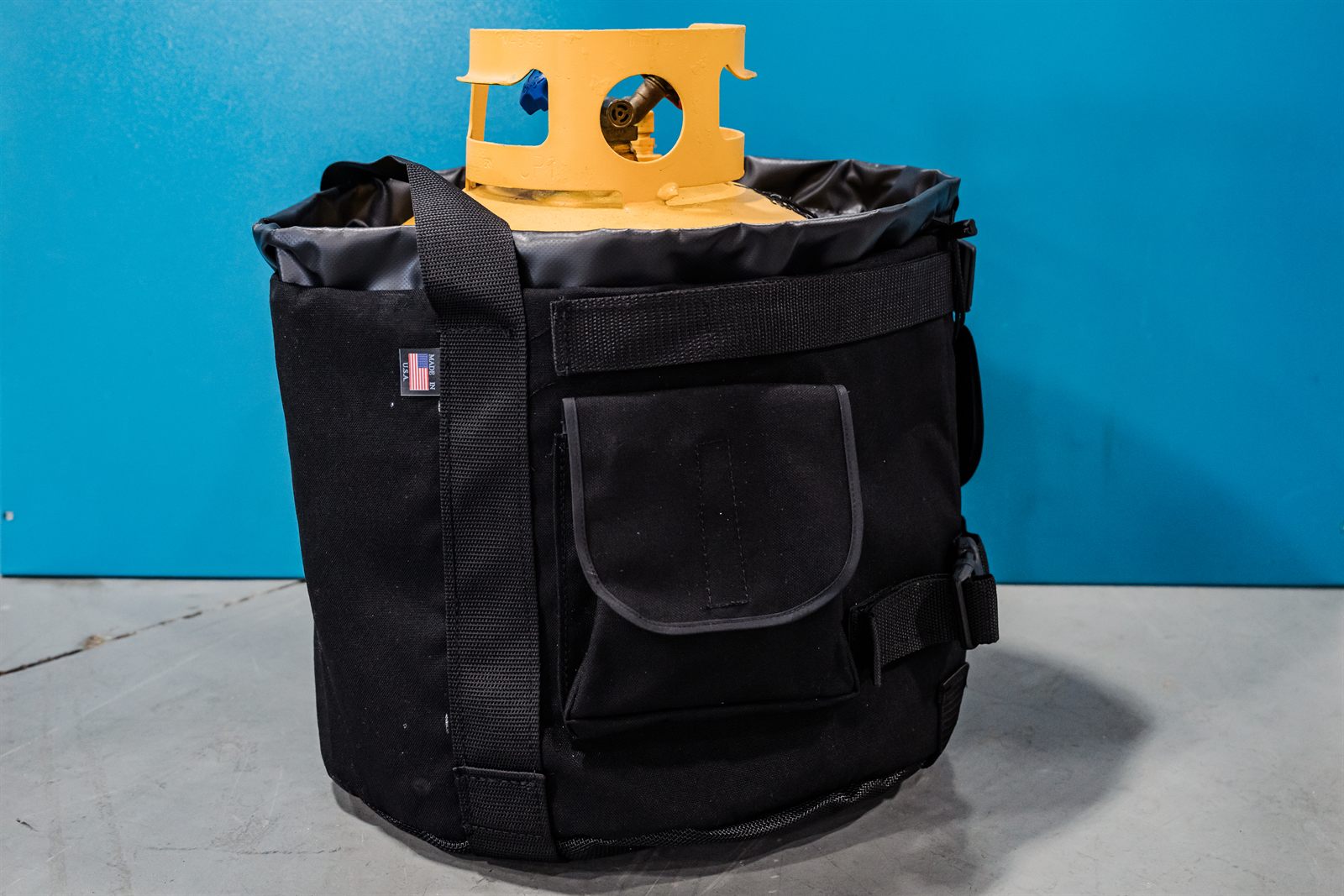 The Tank Cooler's exterior flap pocket for storing gauges, hoses, and hand tools