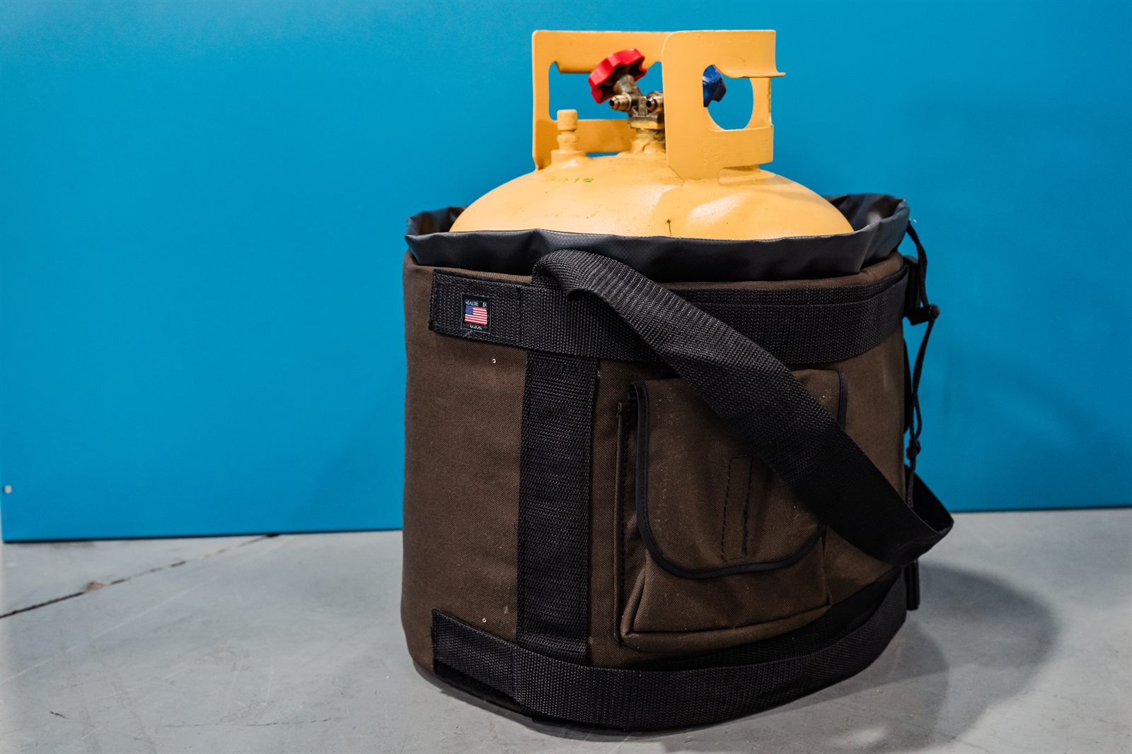 The Tank Cooler in brown canvas holding a refrigerant recovery cylinder